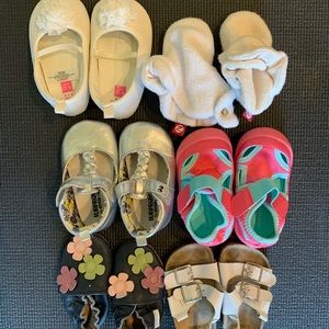 6 pairs of 6 -12 months sized shoes.